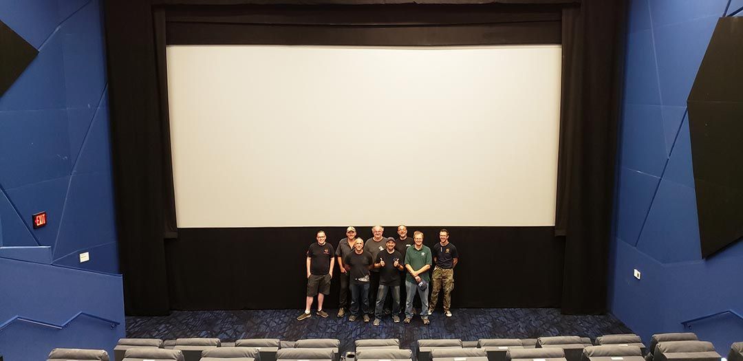 Projection booth with modern and vintage film equipment side by side