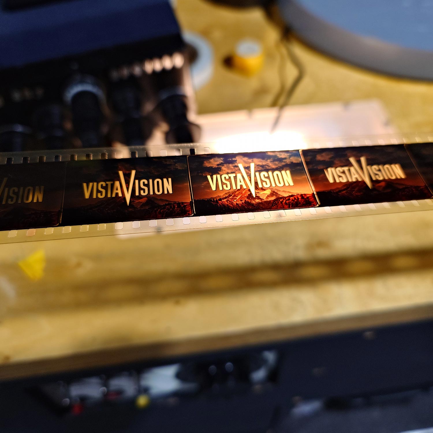 Film strip showing VistaVision logo frames over a mountain sunset scene