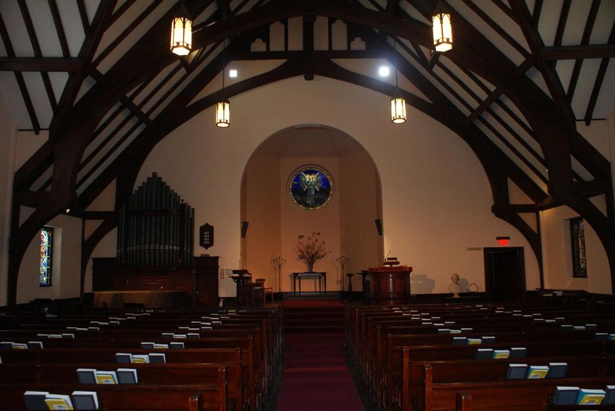 Front view of church interior with vaulted ceiling and altar area