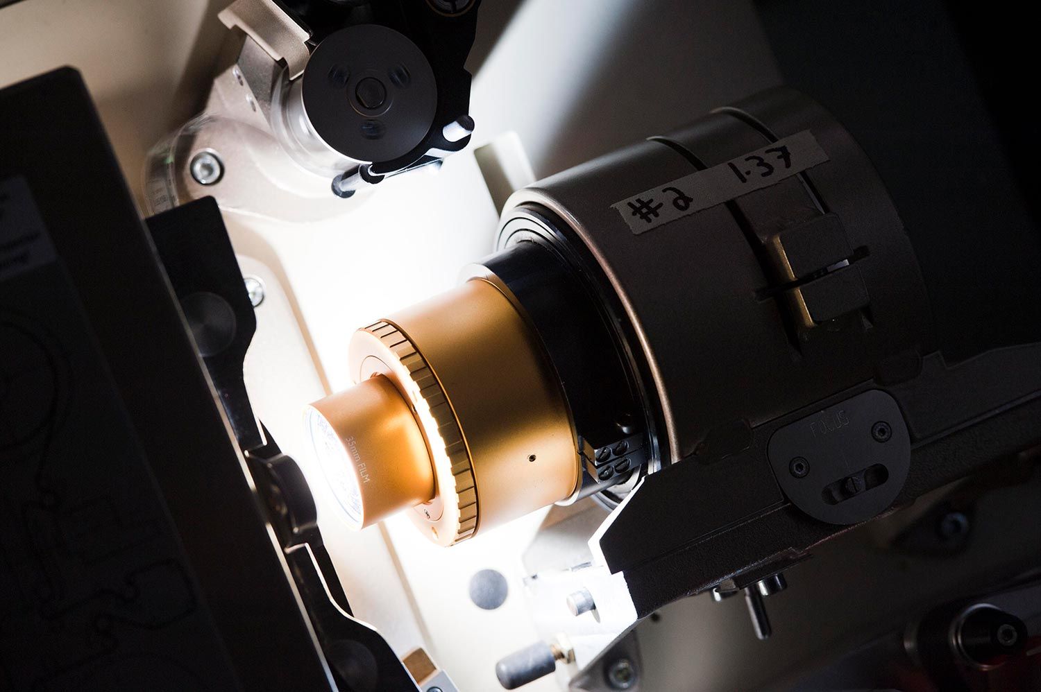 Illuminated lens and roller system on a professional projector